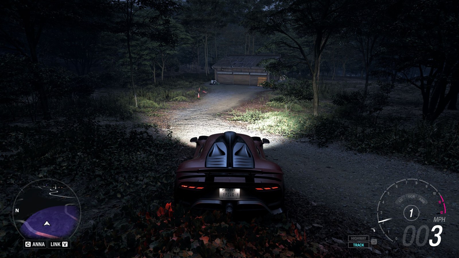 Forza Horizon 6 Barn Finds: A player parked outside an old wooden barn on a wooded hillside at night.