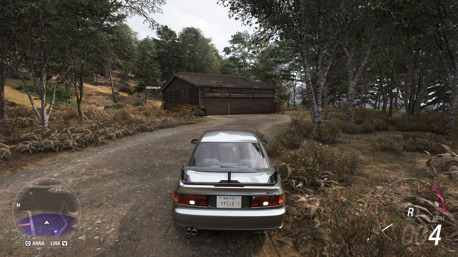 Forza Horizon 6 Barn Finds: A player parked outside an old wooden barn on a wooded hillside.