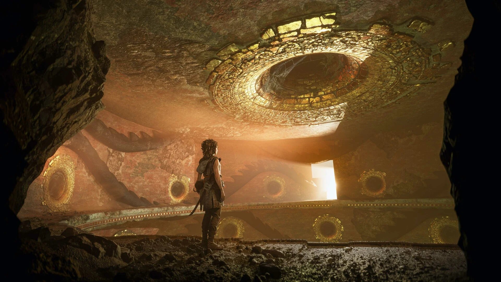 Sophia is shown standing inside of a chamber full of strange holes in Resonance A Plague Tale Legacy.