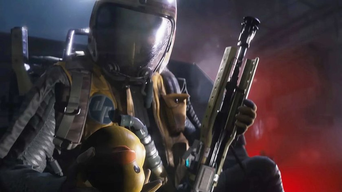 Arc Raiders: A character wearing what looks like a space helmet, crouched behind cover holding a gun in their left hand and a rubber duck in their right hand.