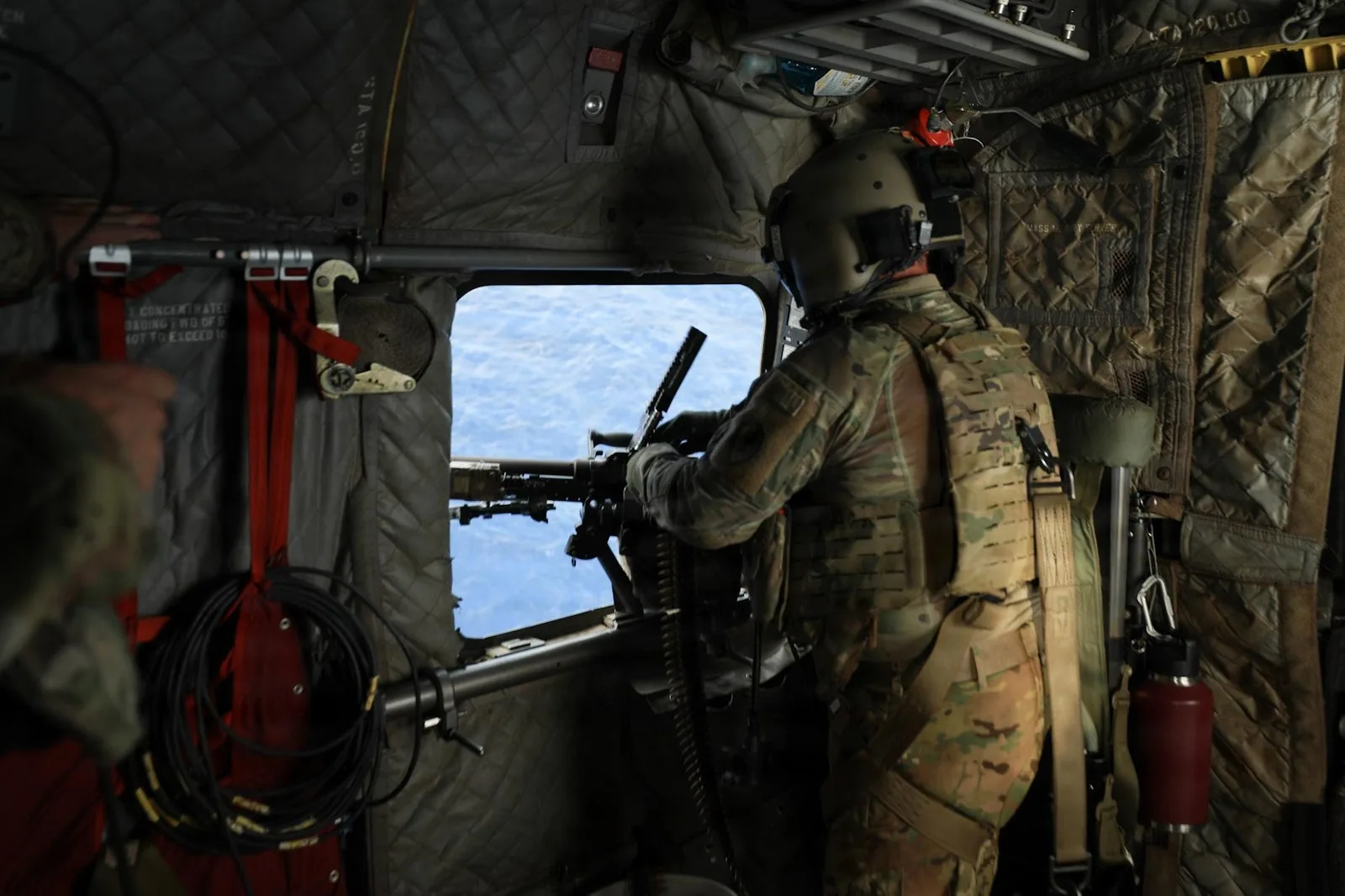 U.S. Army Soldiers assigned to 25th Combat Aviation Brigade, 25th Infantry Division, conduct an experimental over water gunnery exercise in a CH-47 Chinook over the Pacific Ocean, Sept. 29, 2026. U.S. Army's expanded rapid-fielding and modernization initiative is designed to test and integrate emerging technologies directly with soldiers in active formations. (U.S. Army photo by Capt. Katie Kolb)