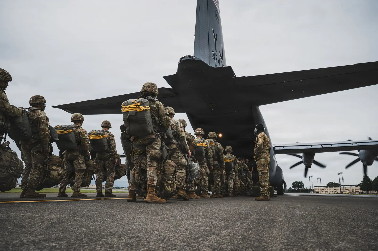 US Army paratroopers assigned to the 11th Airborne Division board a US Air Force C-130J Super Hercules, assigned to the 36th Airlift Squadron, for airdrop training in support of Orient Shield 2026, at Yokota Air Base, Japan, Sept. 15, 2026. (US Air Force photo by Senior Airman Cayla Hunt.)
